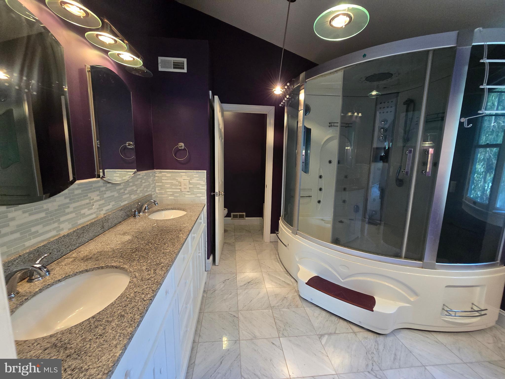 1 Radcliff Court Sicklerville, NJ 08081 - Photo 18 of 40 a bathroom with a granite countertop sink shower and a mirror