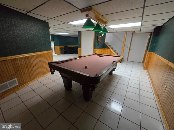 a view of a terrace with wooden floor and table