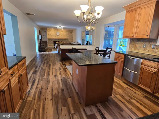 a kitchen with sink and cabinets