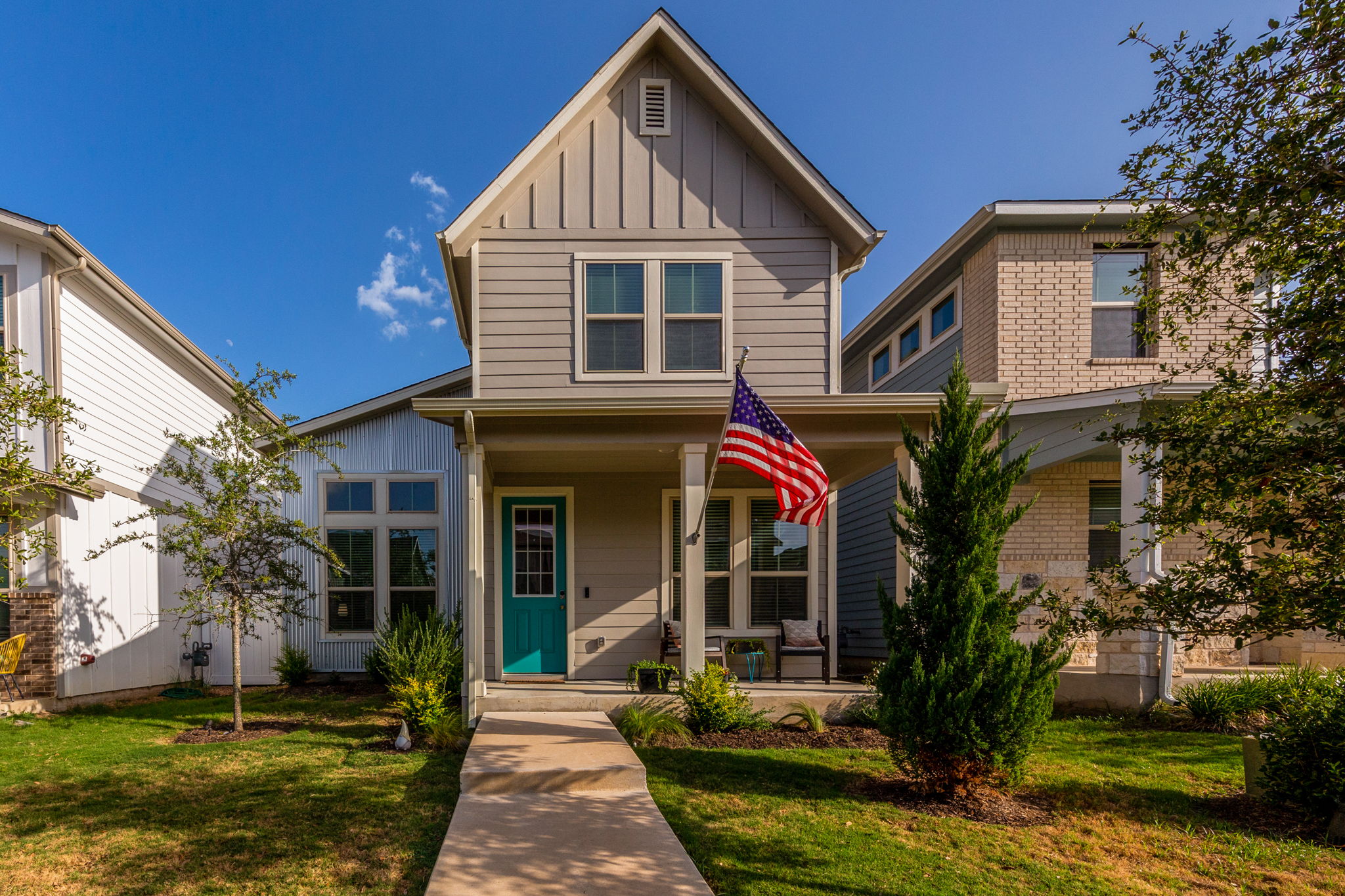 a front view of a house with a yard
