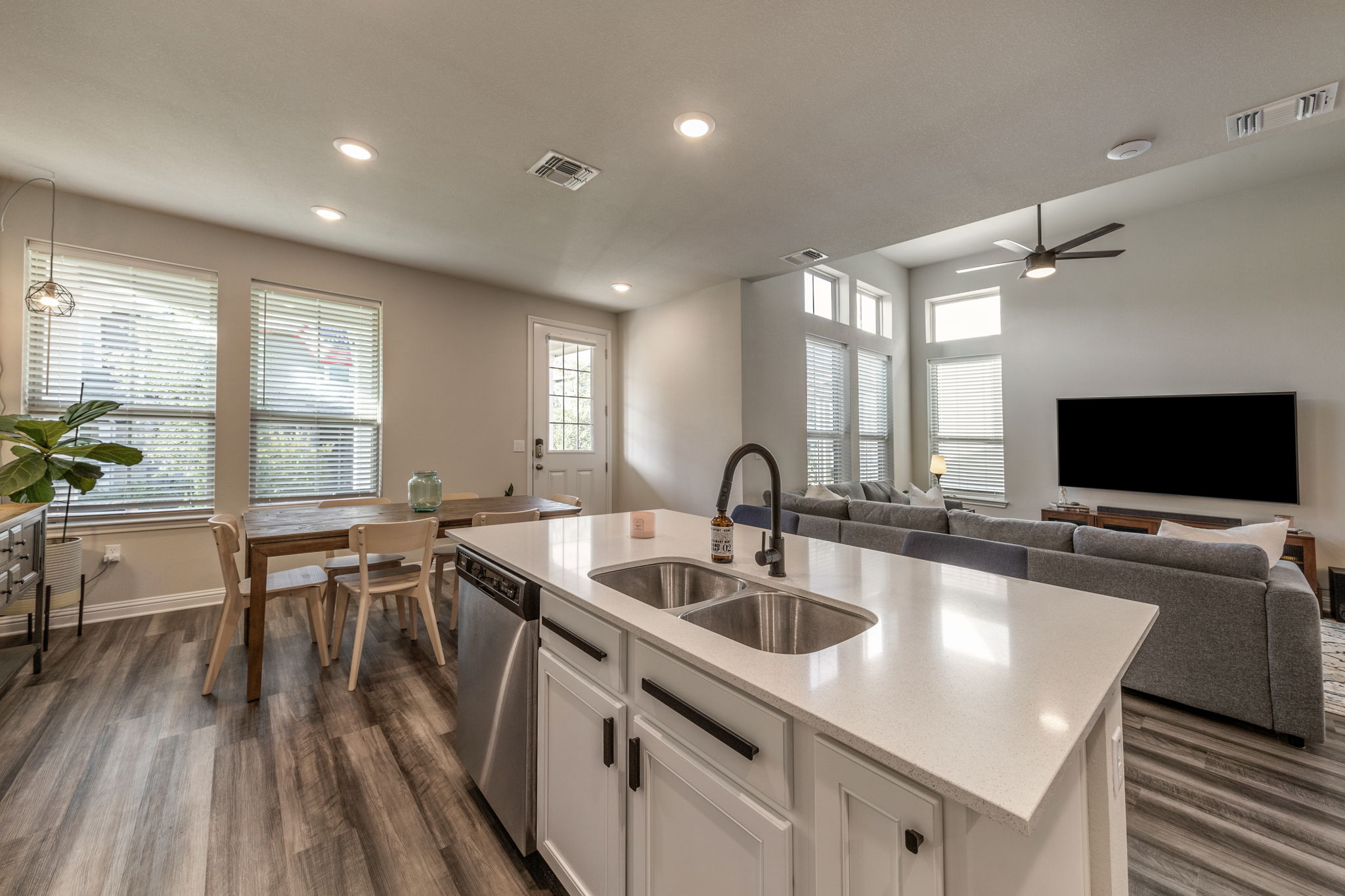 7812 Moody Bend, Unit 38 Austin, TX 78744 - Photo 11 of 39 a kitchen with a sink table and chairs