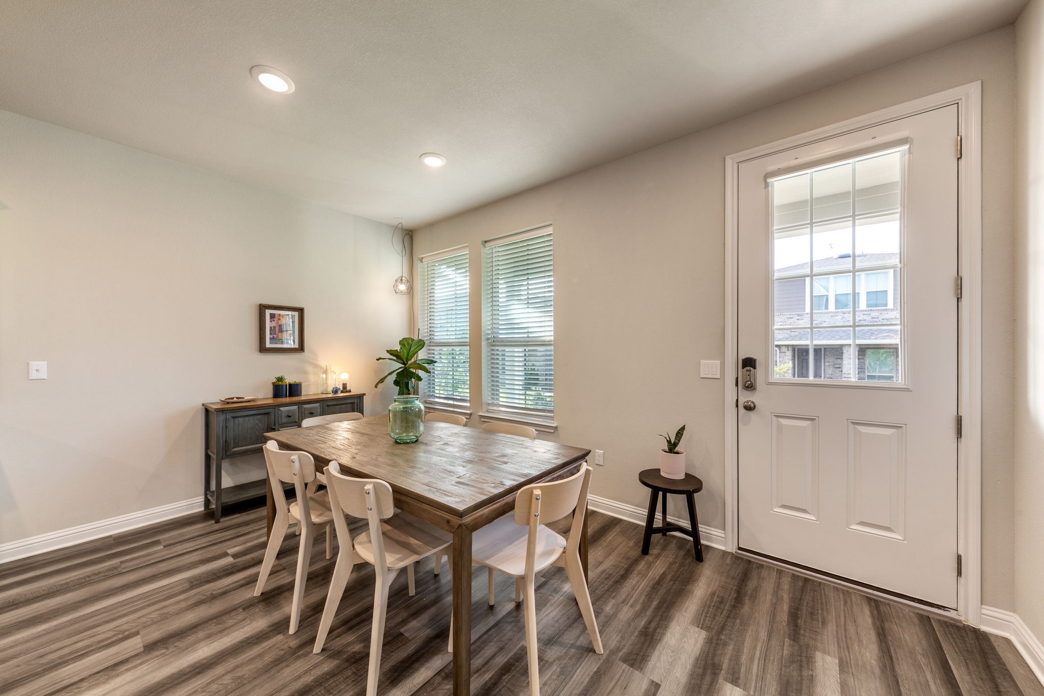 7812 Moody Bend, Unit 38 Austin, TX 78744 - Photo 13 of 39 a view of a dining room with furniture and wooden floor