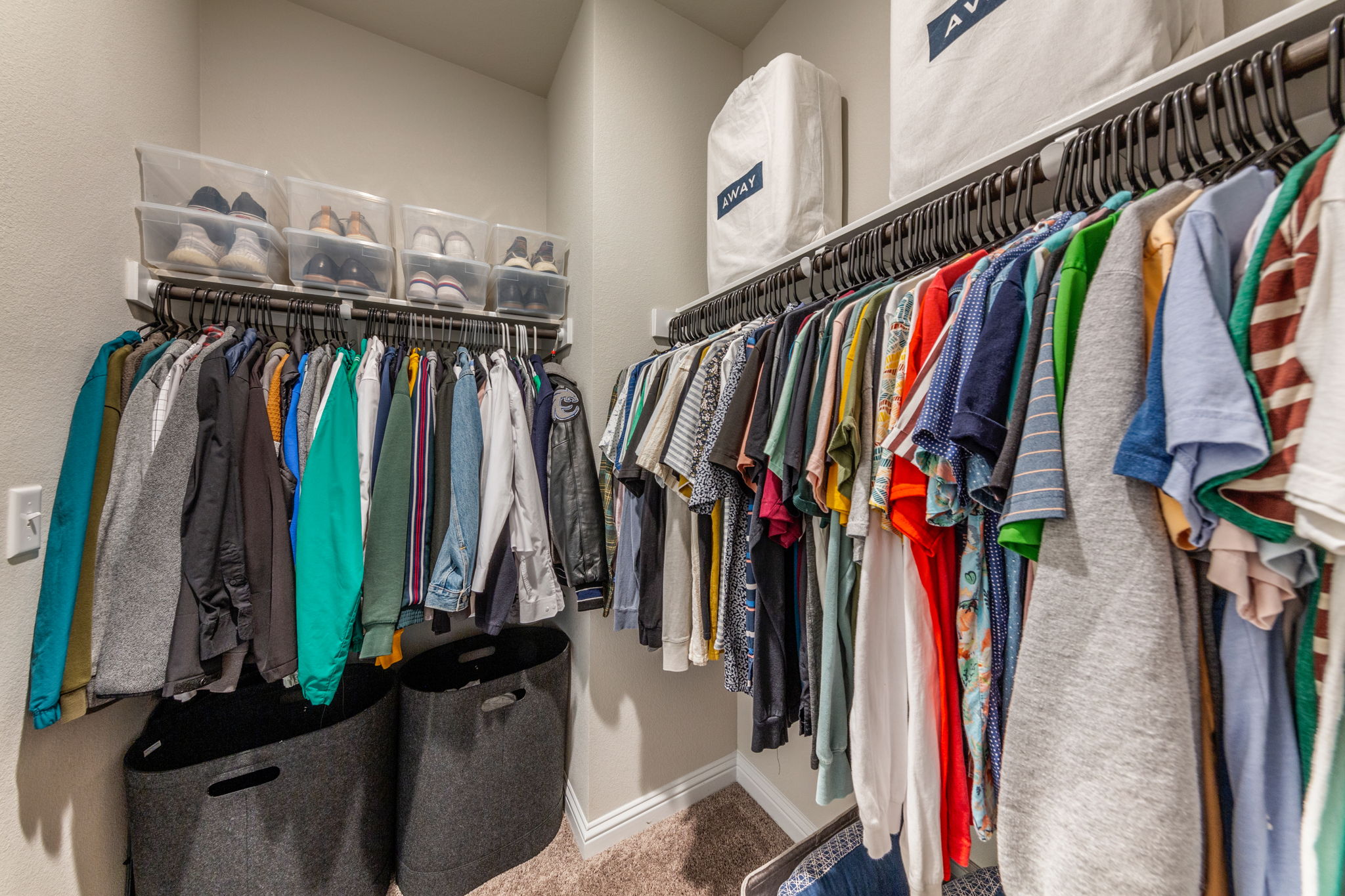 7812 Moody Bend, Unit 38 Austin, TX 78744 - Photo 22 of 39 a view of walk in closet with clothes and shoes