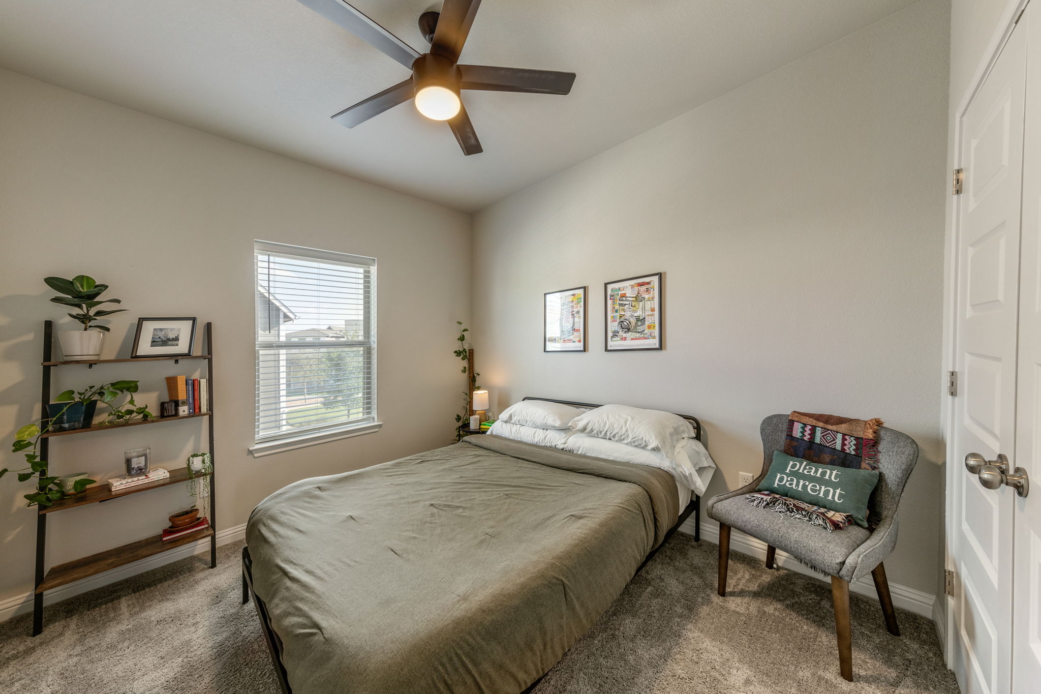 7812 Moody Bend, Unit 38 Austin, TX 78744 - Photo 23 of 39 a bedroom with a bed and a window
