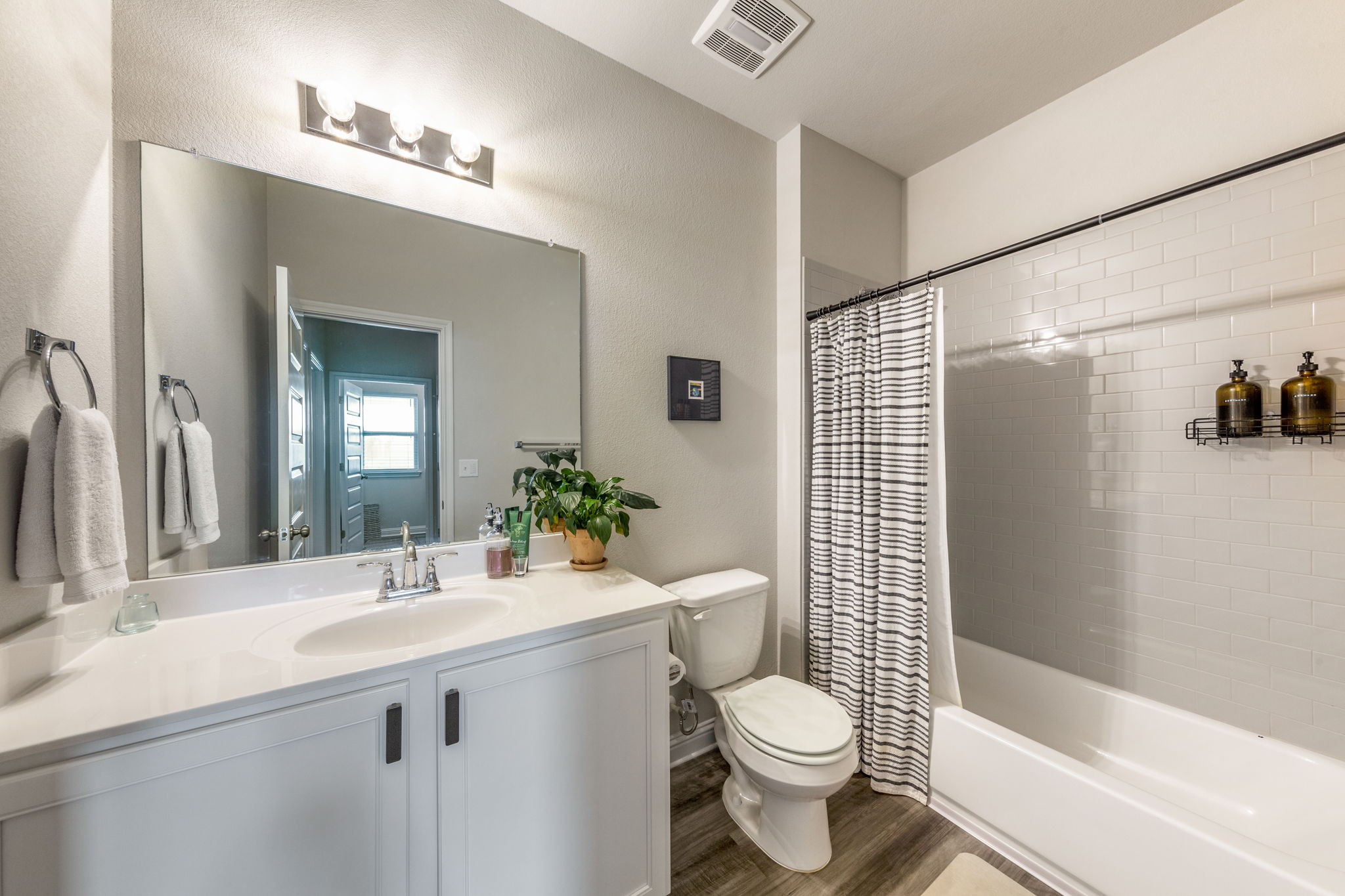 7812 Moody Bend, Unit 38 Austin, TX 78744 - Photo 25 of 39 a bathroom with a sink a toilet and shower