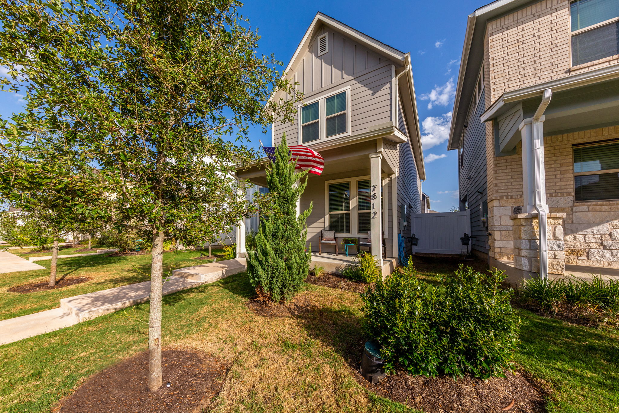 7812 Moody Bend, Unit 38 Austin, TX 78744 - Photo 38 of 39 a view of a house with a yard