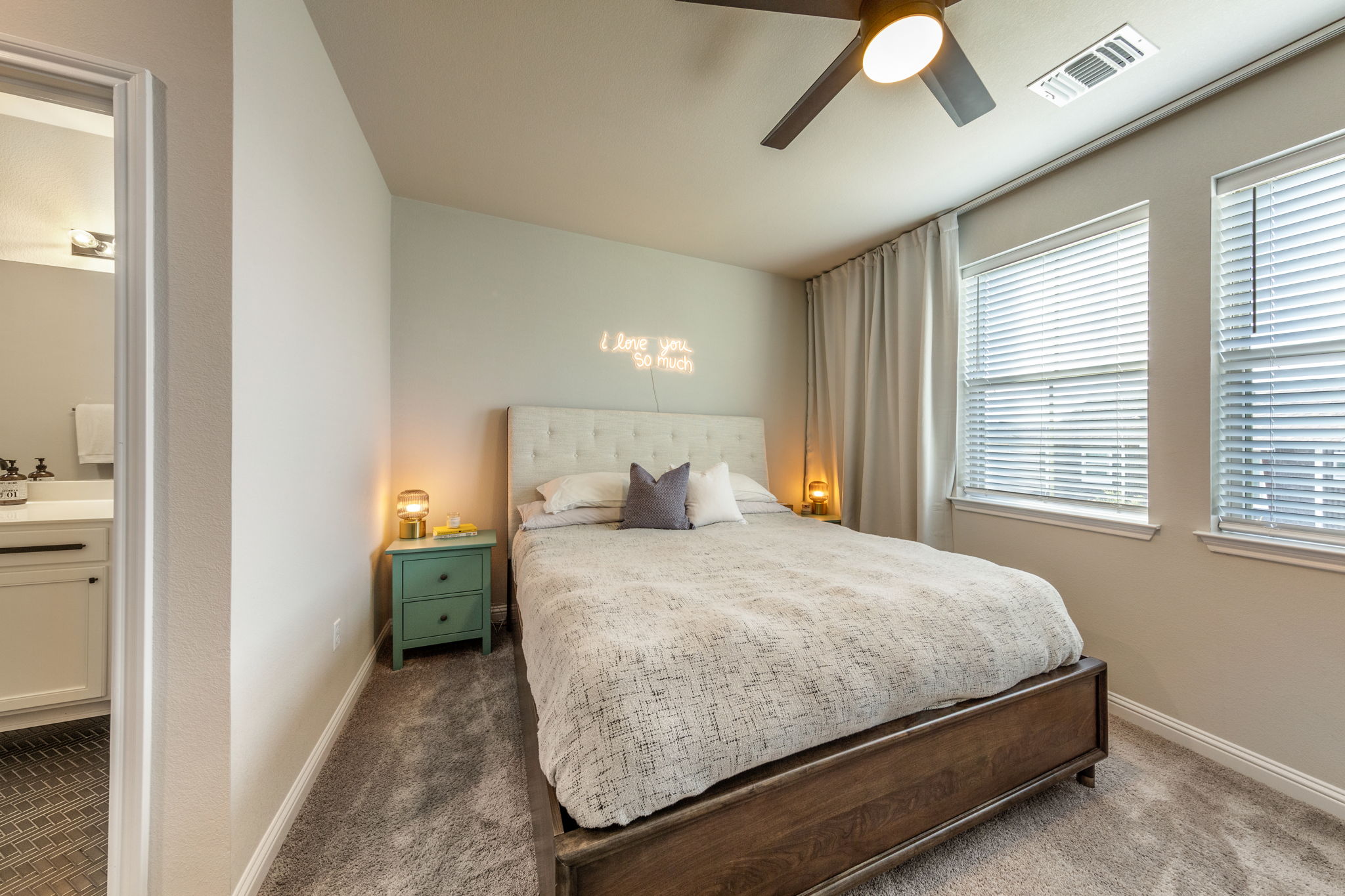 7812 Moody Bend, Unit 38 Austin, TX 78744 - Photo 4 of 39 a bedroom with a bed and window