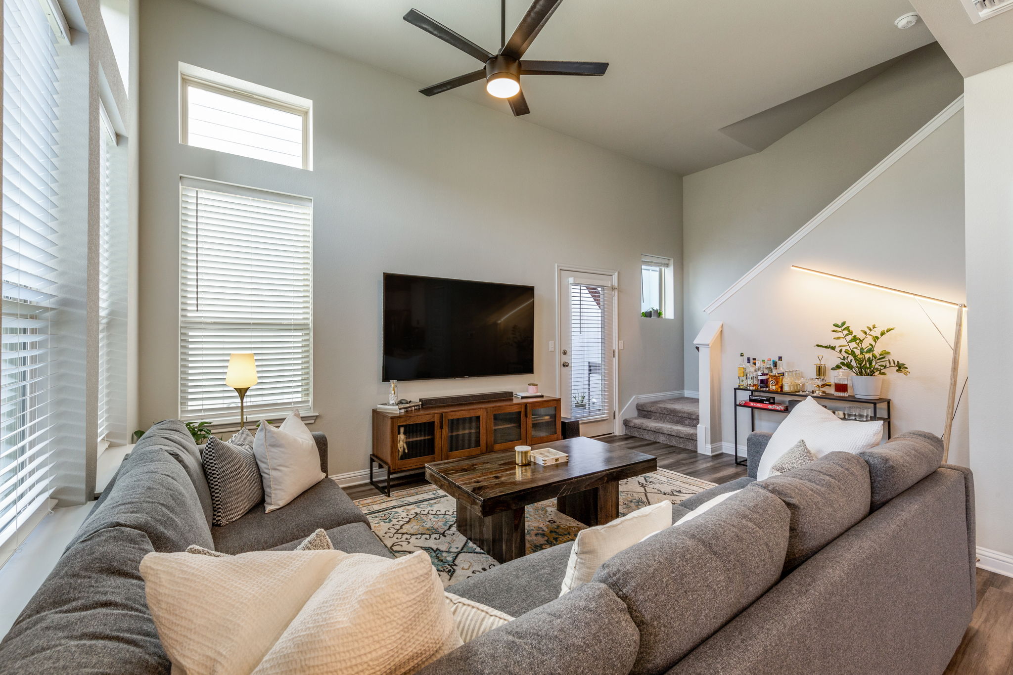 7812 Moody Bend, Unit 38 Austin, TX 78744 - Photo 7 of 39 a living room with furniture and a flat screen tv