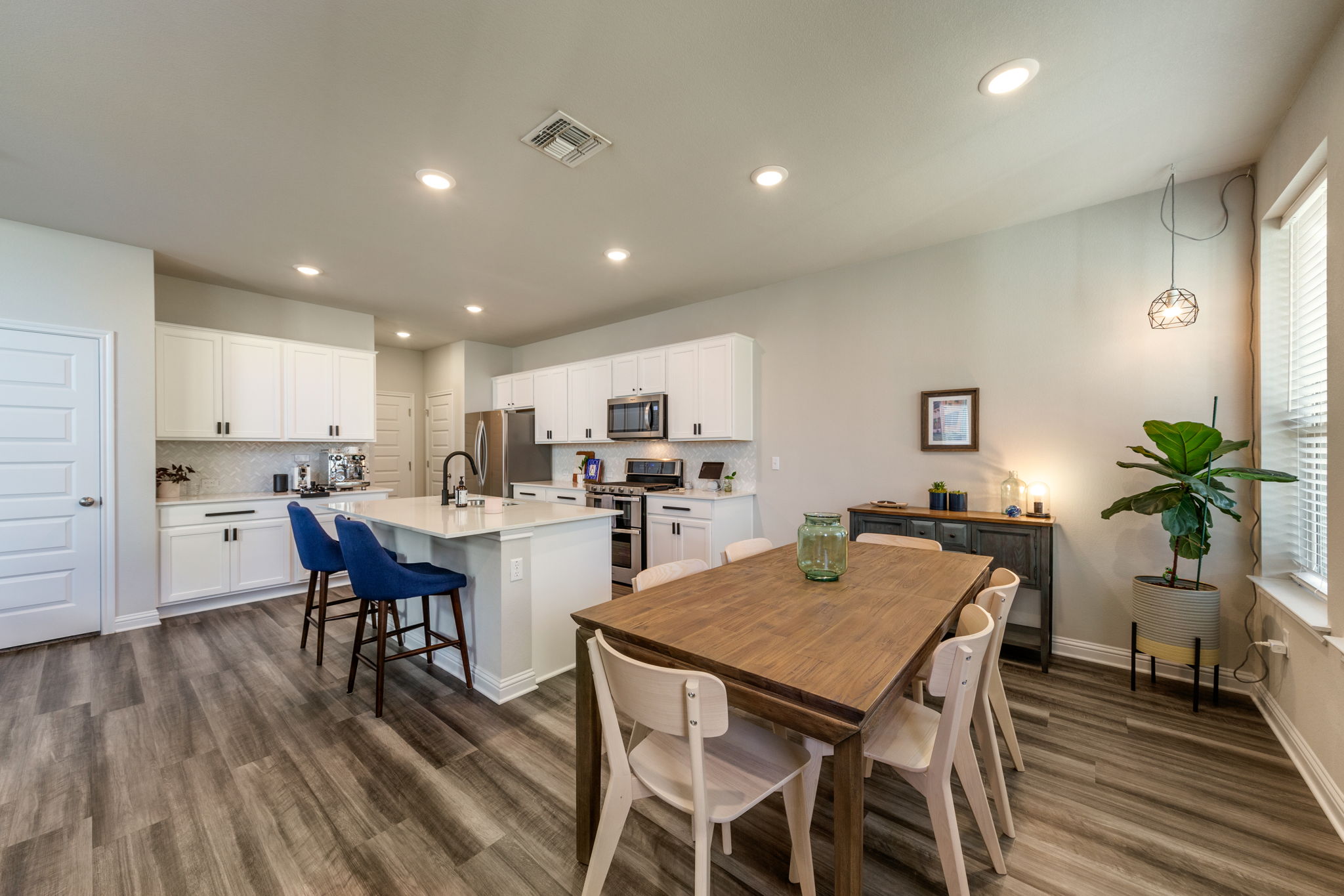 7812 Moody Bend, Unit 38 Austin, TX 78744 - Photo 8 of 39 a view of a dining room with furniture and wooden floor