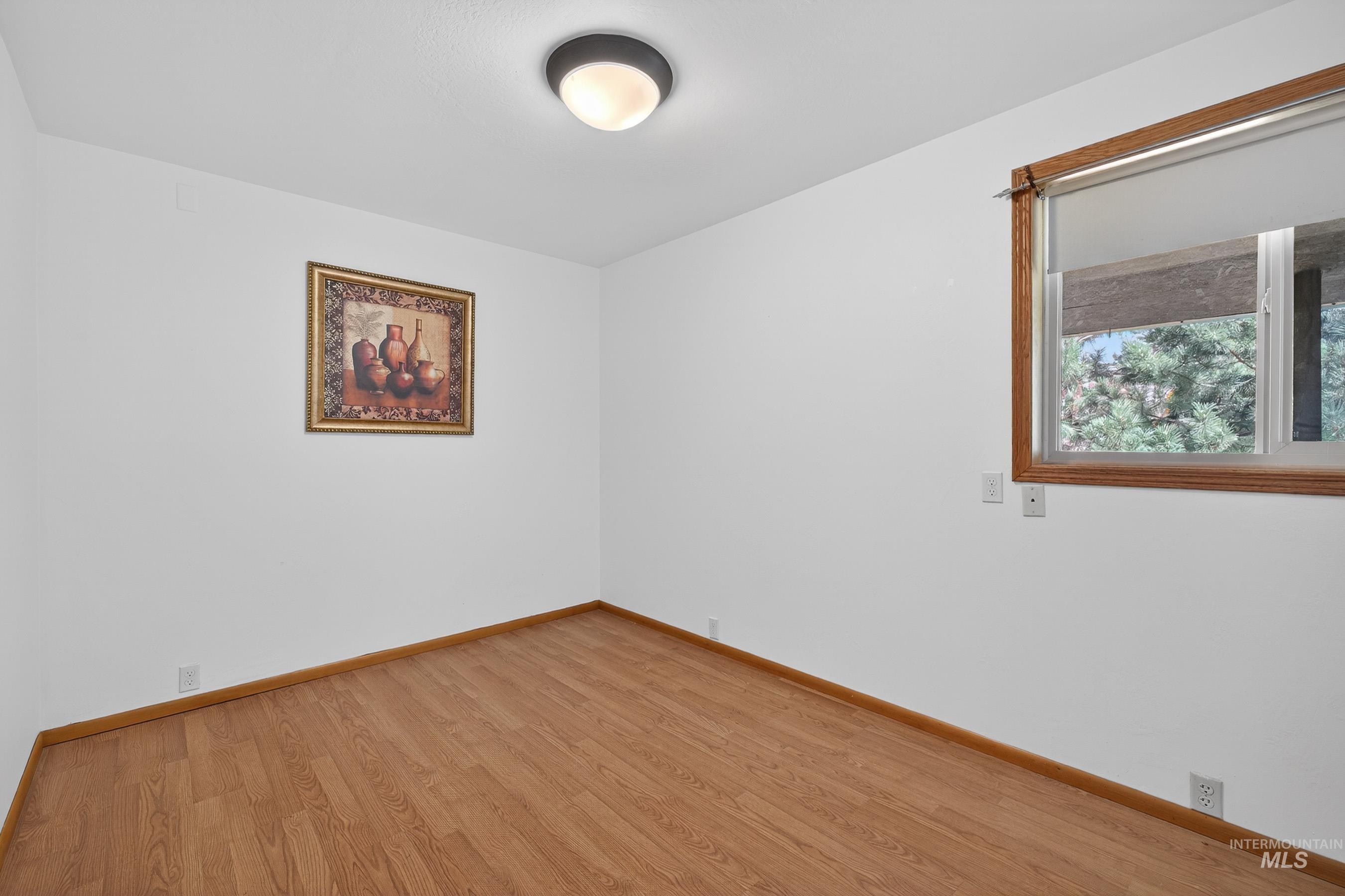 1352 South Main Street Riggins, ID 83549 - Photo 22 of 50 Spare room with light wood-type flooring and baseboards