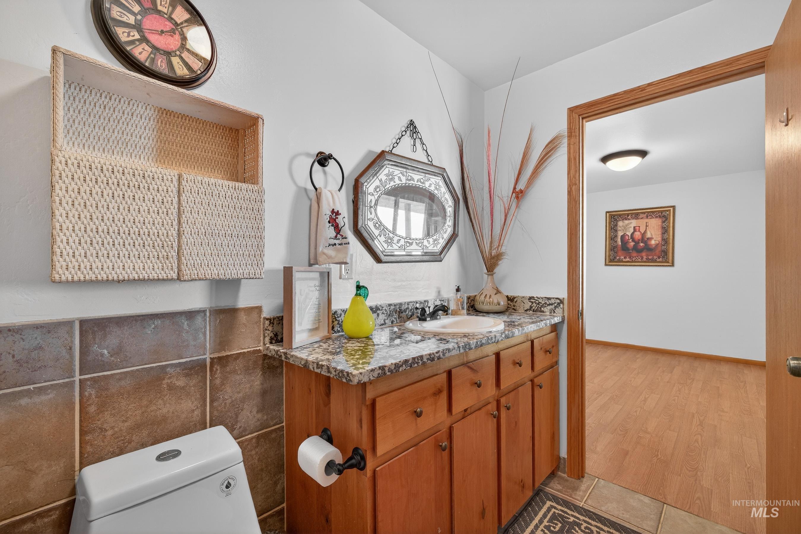 1352 South Main Street Riggins, ID 83549 - Photo 23 of 50 Half bathroom with vanity and light tile patterned flooring
