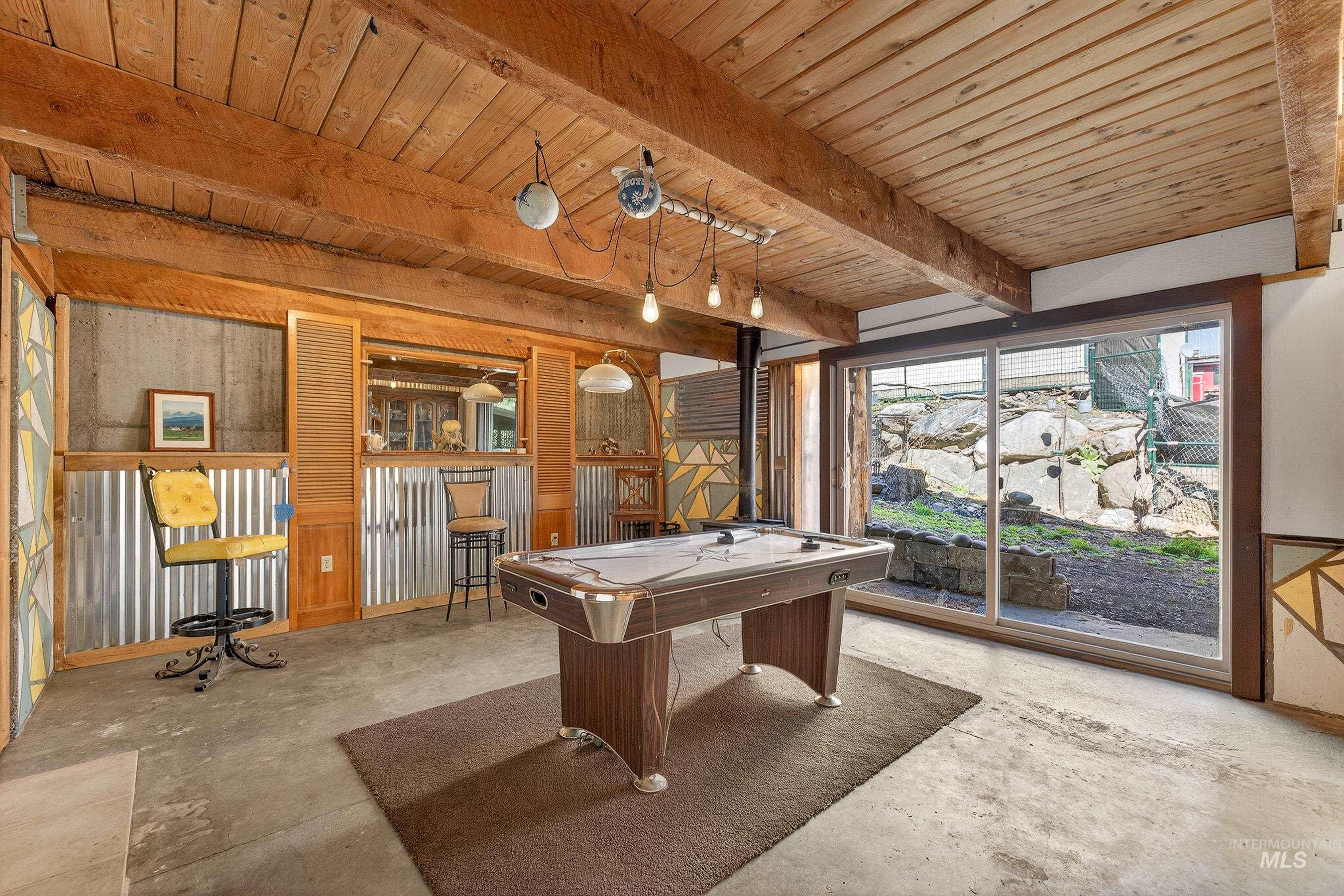 1352 South Main Street Riggins, ID 83549 - Photo 29 of 50 Playroom with concrete flooring, pool table, and a wooden ceiling with exposed beams