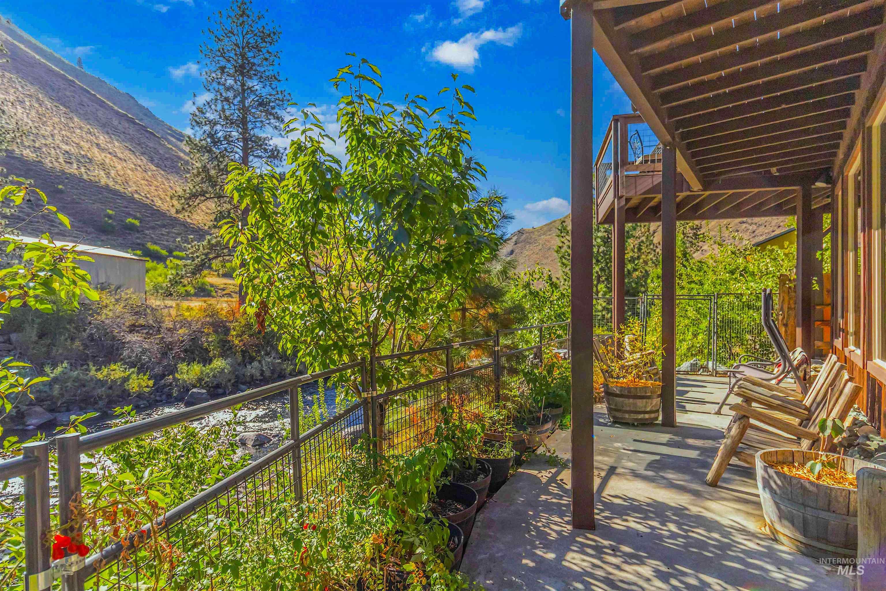 1352 South Main Street Riggins, ID 83549 - Photo 3 of 50 Patio / terrace with a mountain view and a fenced backyard