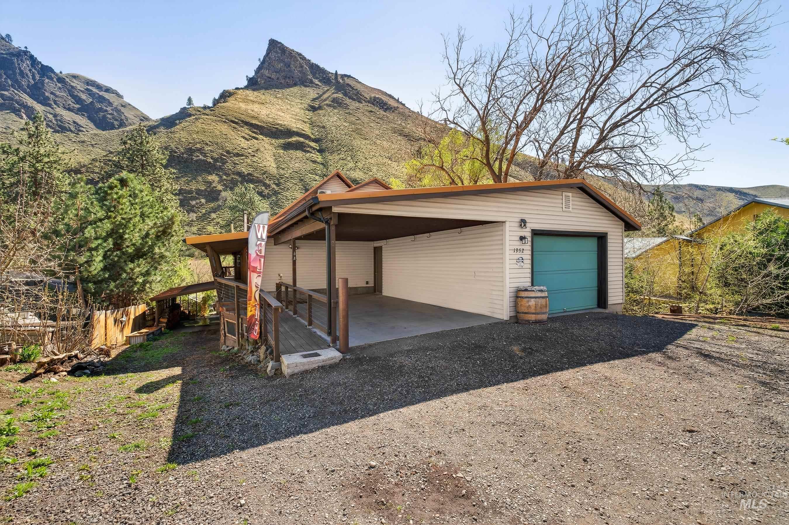 1352 South Main Street Riggins, ID 83549 - Photo 41 of 50 Garage with a mountain view, driveway, and a detached garage