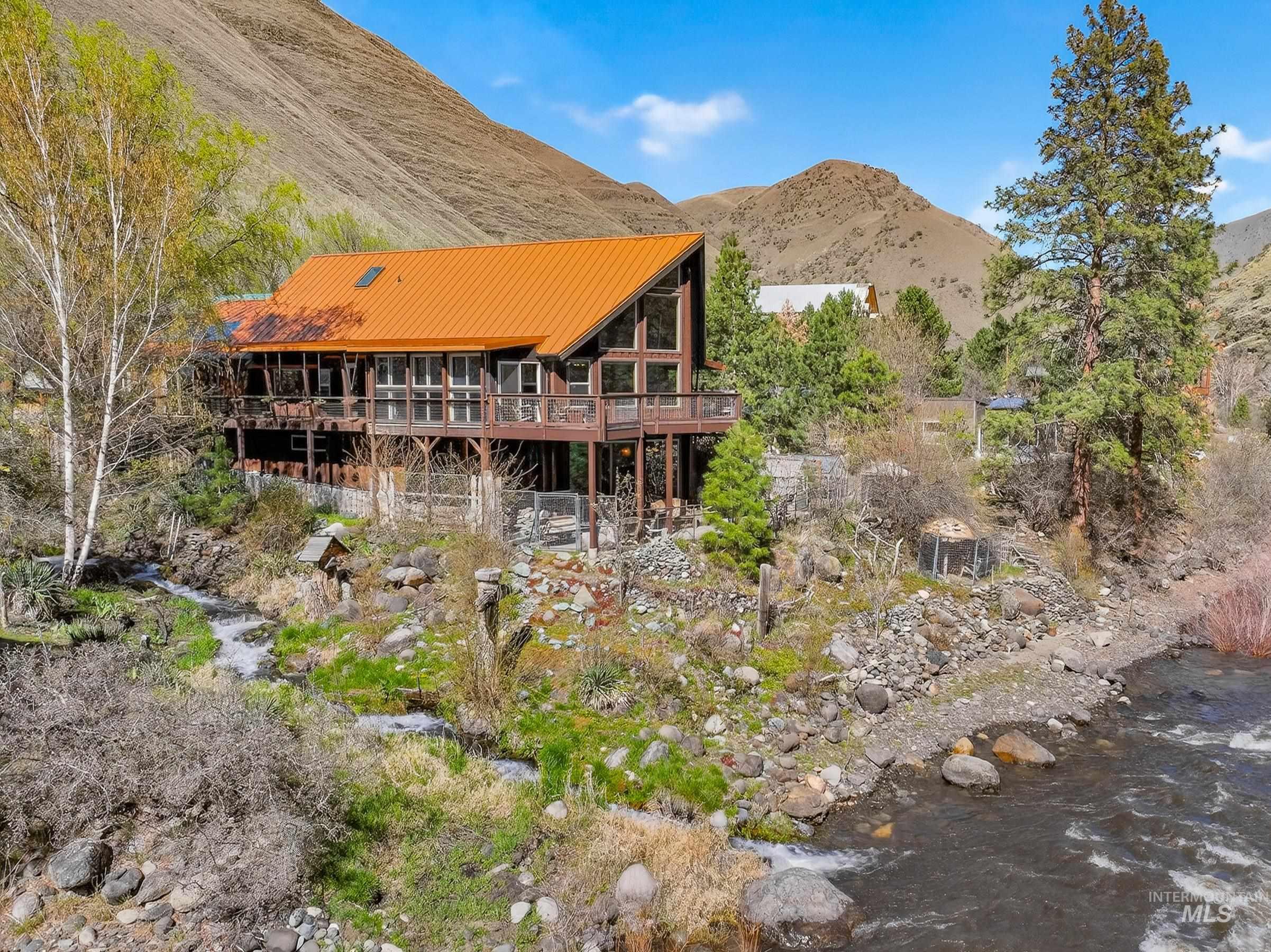 1352 South Main Street Riggins, ID 83549 - Photo 45 of 50 Rear view of property featuring a metal roof and a deck with water view
