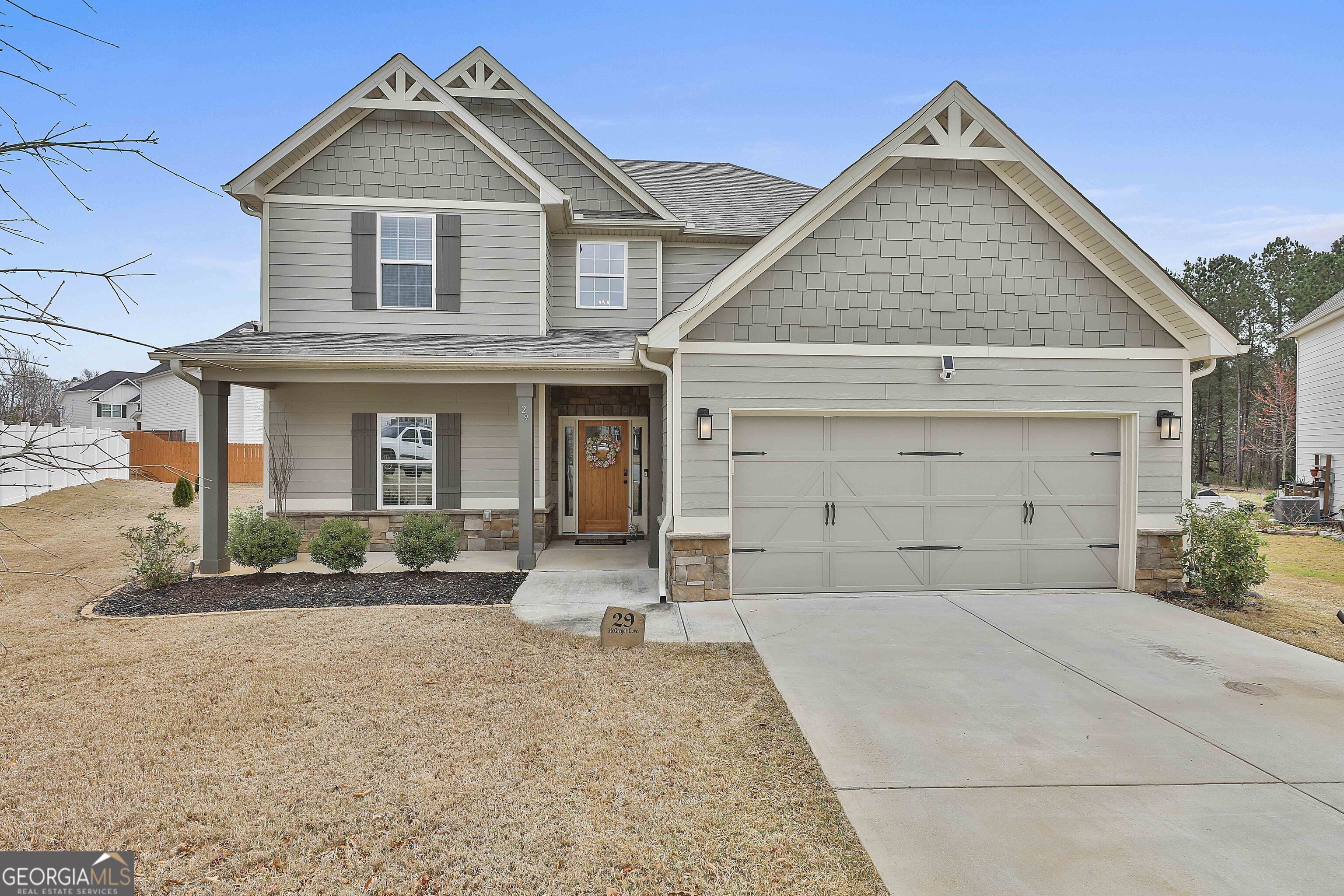 front view of a house with a yard