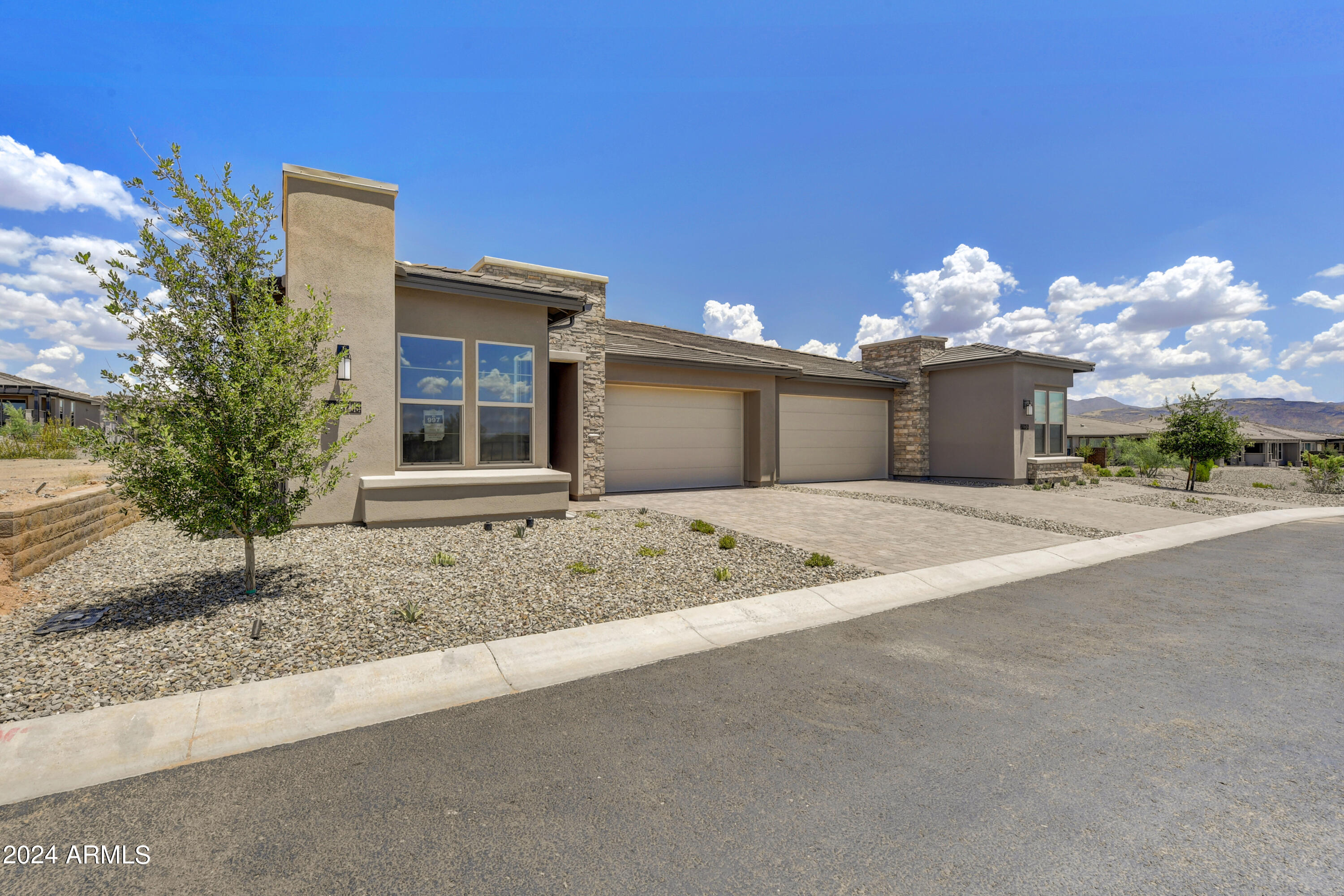 18238 East Coronado Cave Court Rio Verde, AZ 85263 - Photo 1 of 45 a view of a house with a yard and potted plants