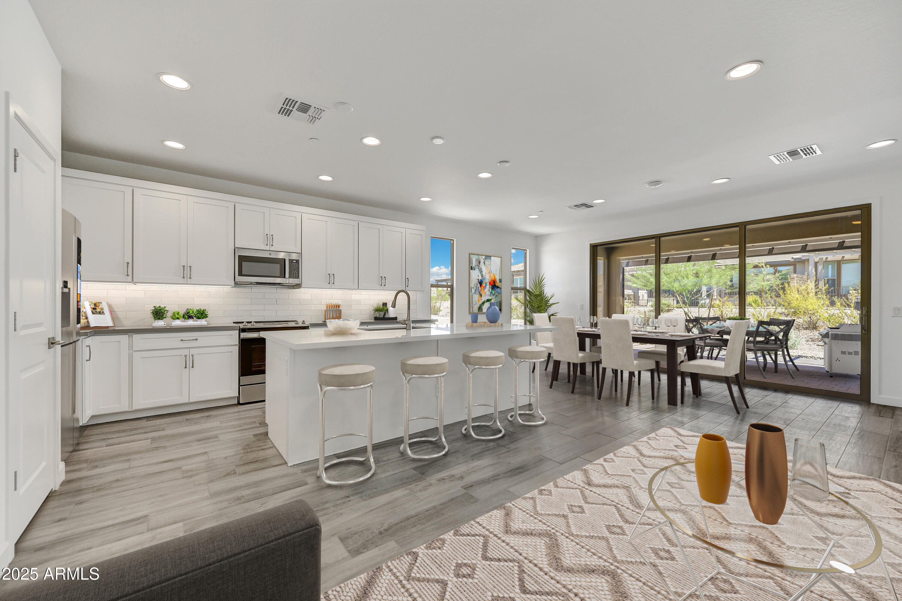 18238 East Coronado Cave Court Rio Verde, AZ 85263 - Photo 11 of 45 a kitchen with a table chairs and white appliances
