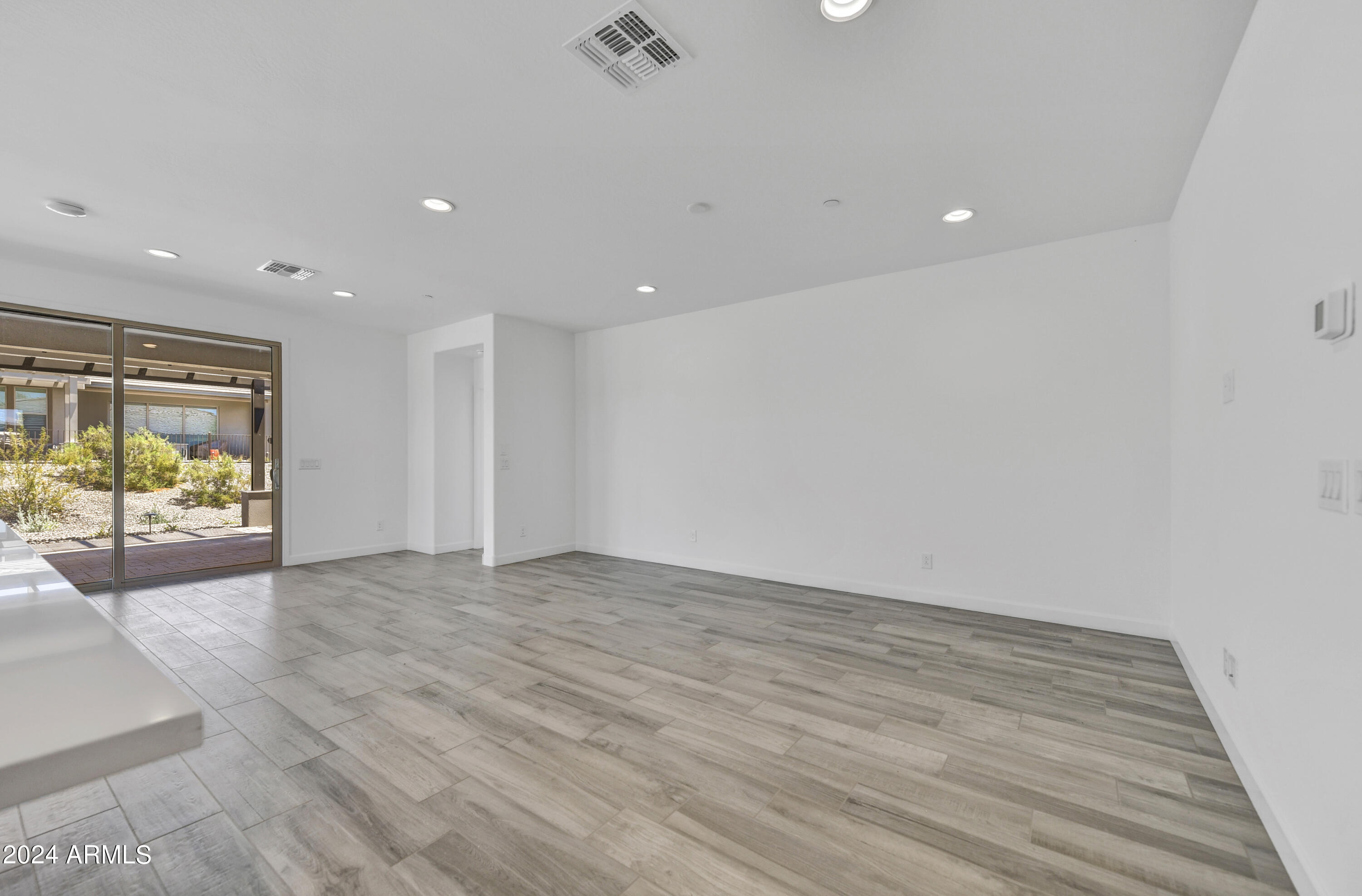 18238 East Coronado Cave Court Rio Verde, AZ 85263 - Photo 14 of 45 an empty room with wooden floor and windows