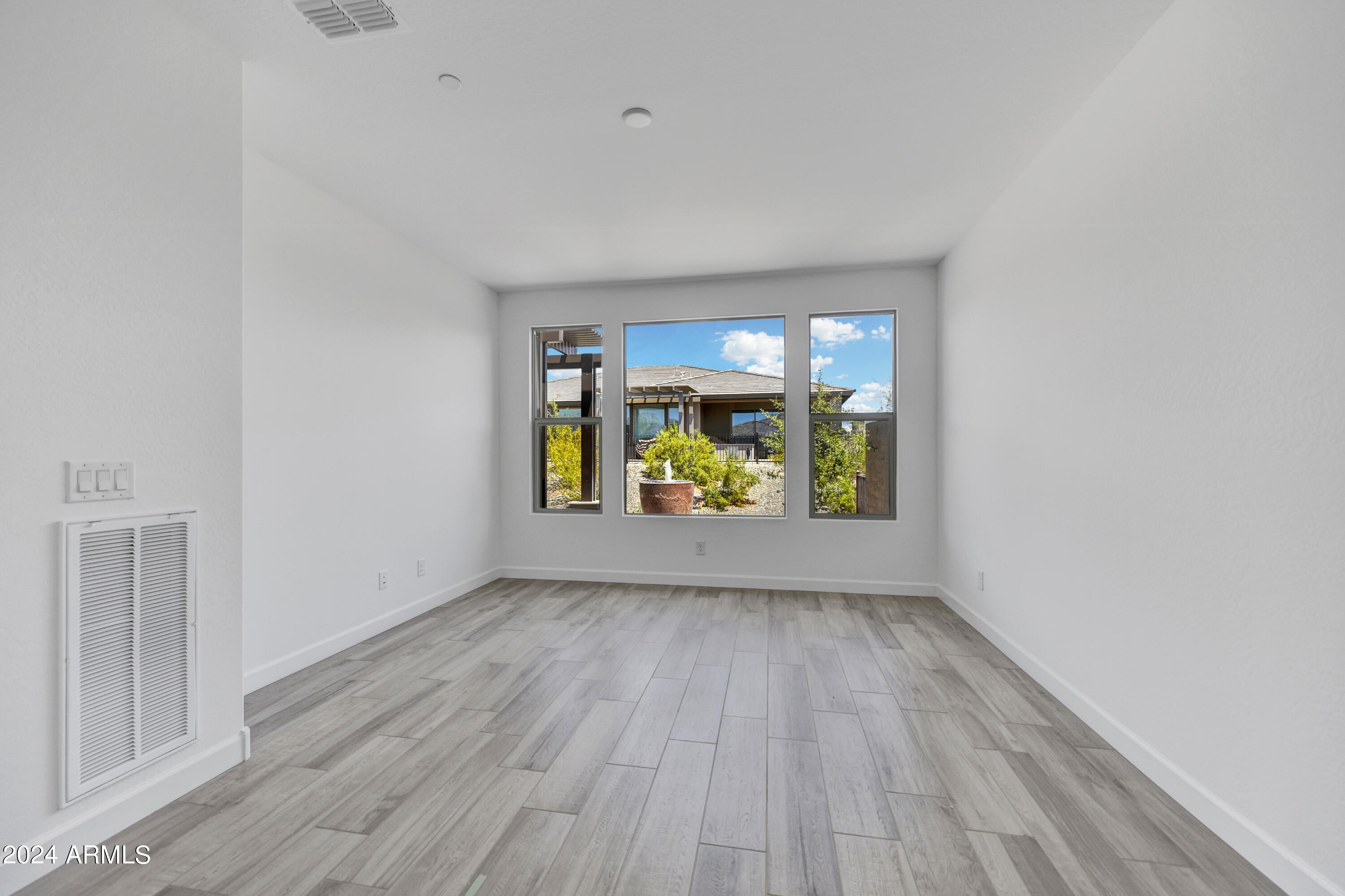 18238 East Coronado Cave Court Rio Verde, AZ 85263 - Photo 16 of 45 wooden floor in an empty room with a window