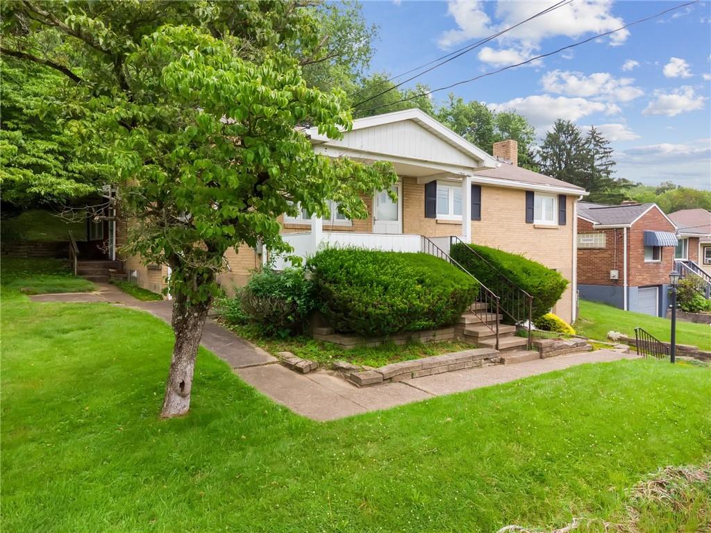 49 Millersdale Road Jeannette, PA 15644 - Photo 2 of 33 a view of a house with a backyard and a patio