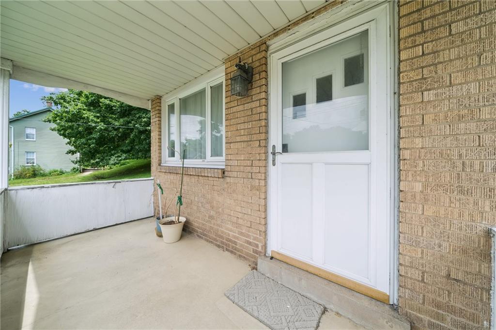 49 Millersdale Road Jeannette, PA 15644 - Photo 26 of 33 a view of a porch with a bench