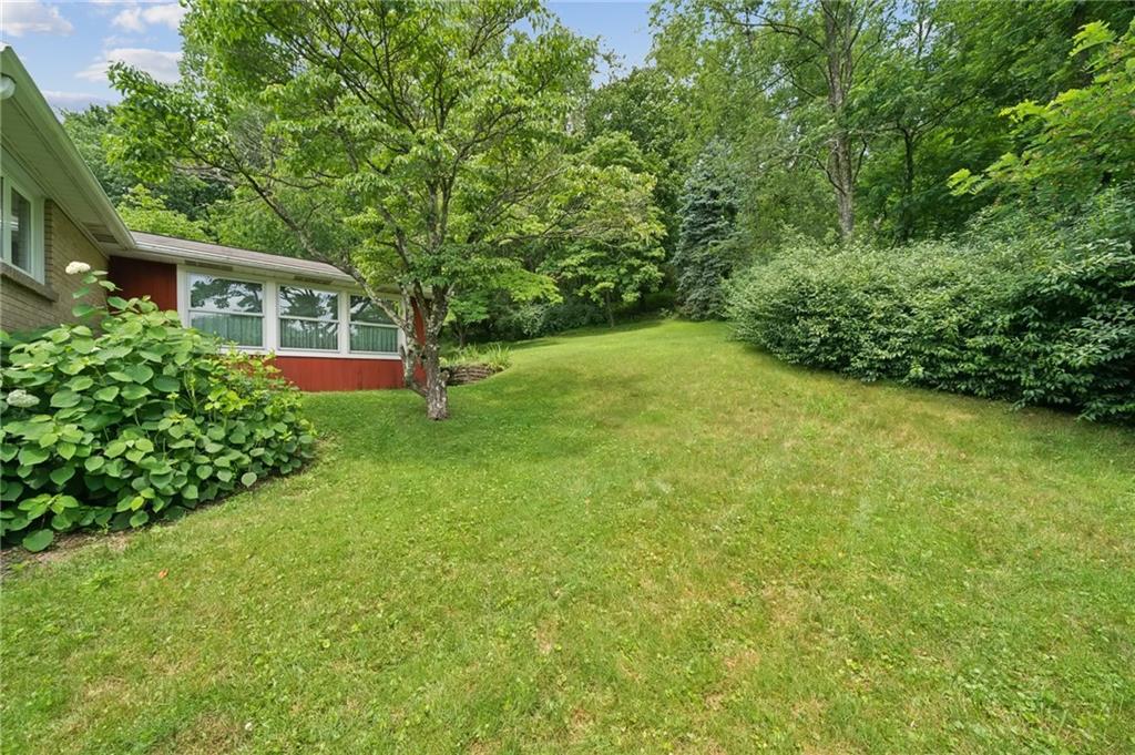 49 Millersdale Road Jeannette, PA 15644 - Photo 27 of 33 front view of a house with a yard