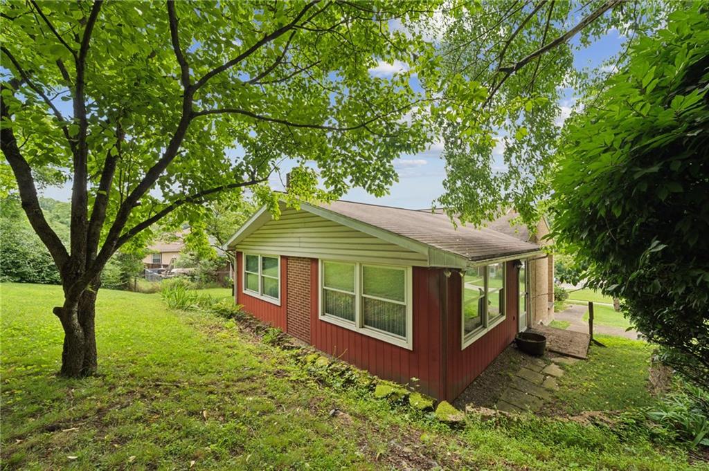49 Millersdale Road Jeannette, PA 15644 - Photo 30 of 33 a front view of a house with garden