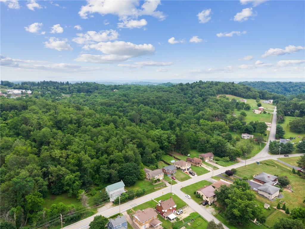 49 Millersdale Road Jeannette, PA 15644 - Photo 32 of 33 a view of a city with lush green forest