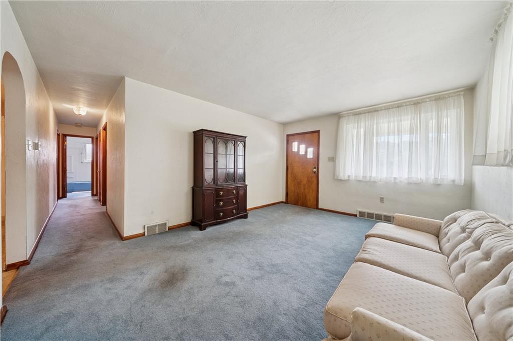 49 Millersdale Road Jeannette, PA 15644 - Photo 4 of 33 a living room with furniture and windows
