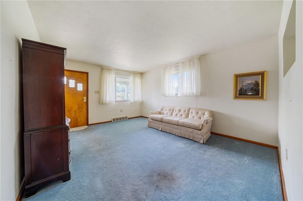 49 Millersdale Road Jeannette, PA 15644 - Photo 5 of 33 a spacious bedroom with a bed and a window
