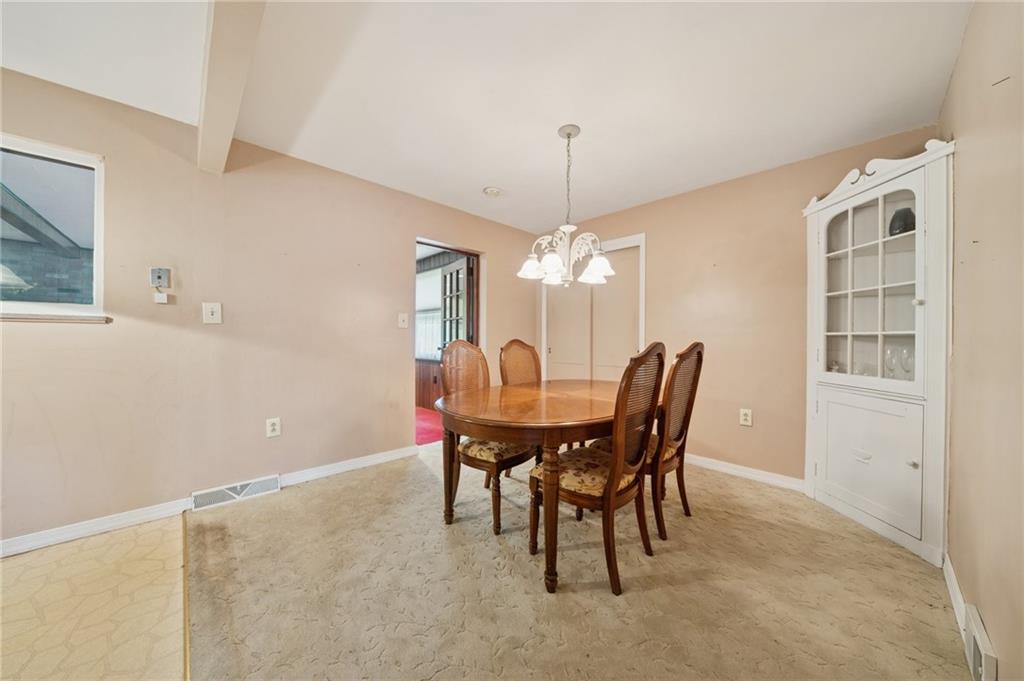 49 Millersdale Road Jeannette, PA 15644 - Photo 7 of 33 a view of a dining room with furniture and chandelier