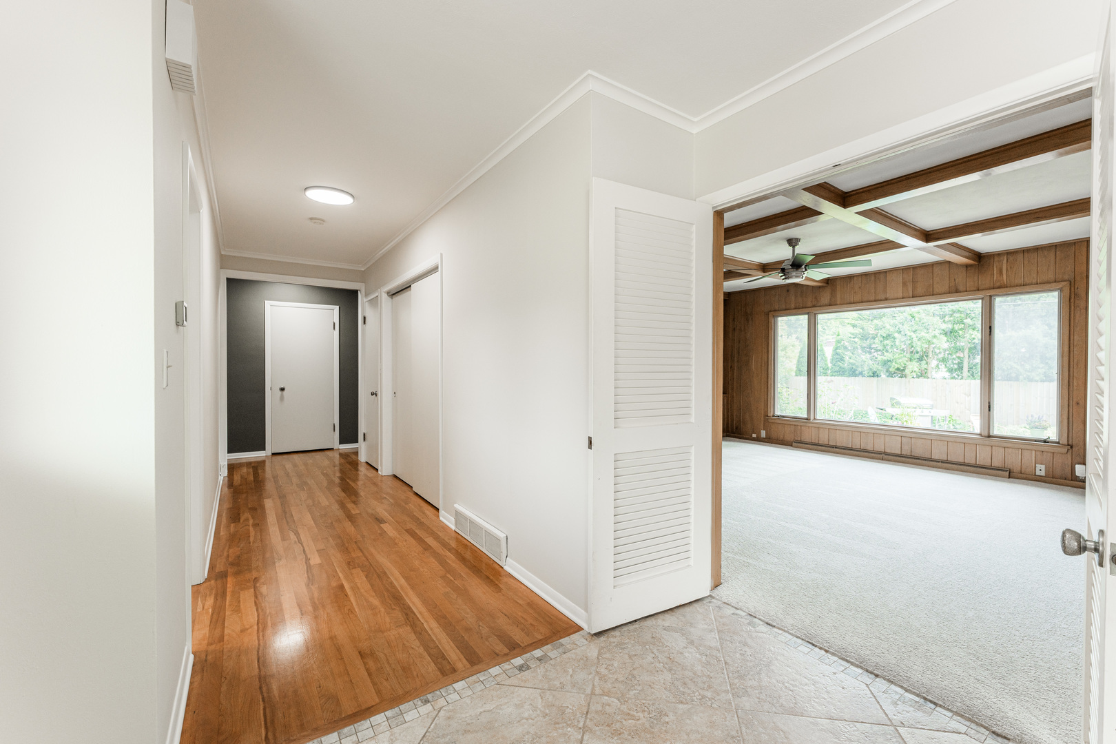 226 Windsor Drive DeKalb, IL 60115 - Photo 18 of 34 a view of hallway with a large window and doors