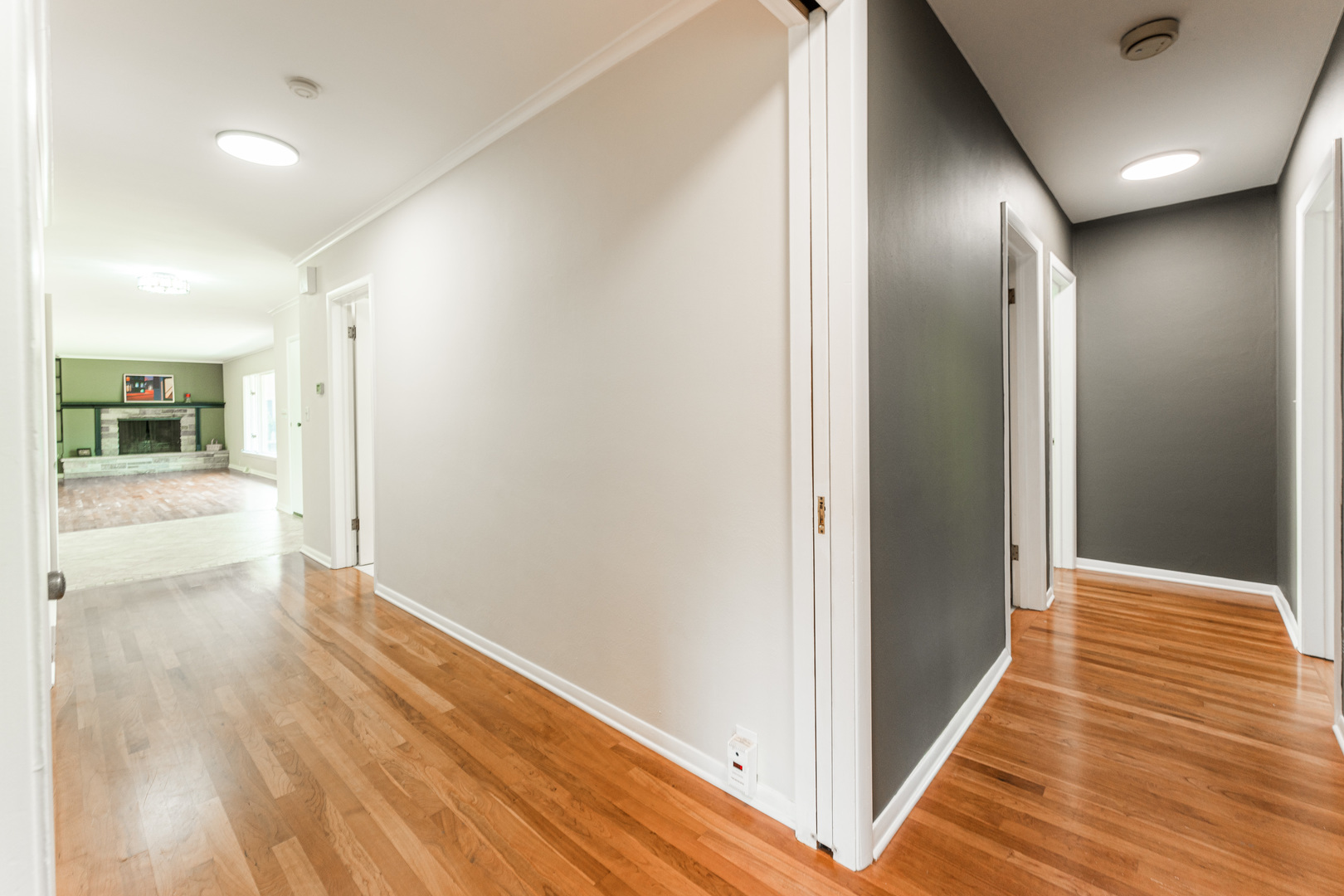 226 Windsor Drive DeKalb, IL 60115 - Photo 19 of 34 a view of a hallway with wooden floor