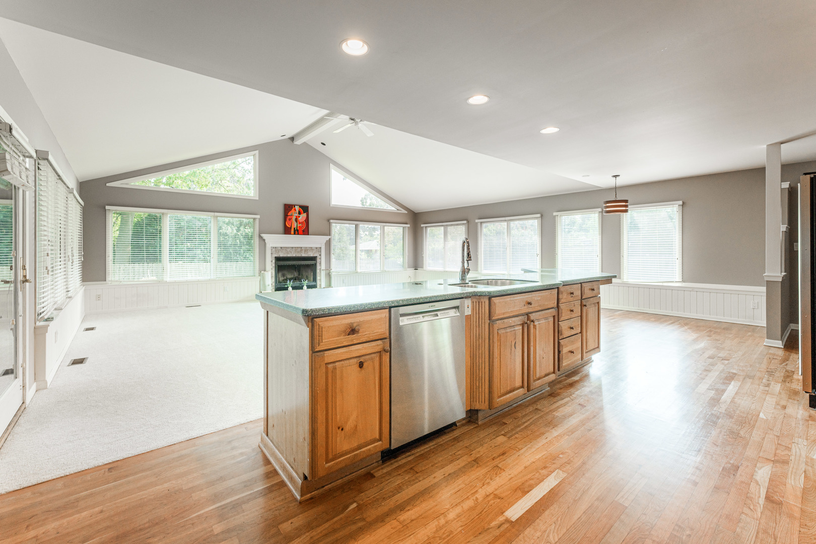 226 Windsor Drive DeKalb, IL 60115 - Photo 7 of 34 a kitchen with granite countertop a stove a sink and a refrigerator