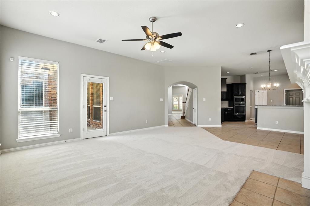 8220 Holliday Road Lantana, TX 76226 - Photo 27 of 40 Spacious living area featuring light-toned carpet, recessed lighting, and a ceiling fan