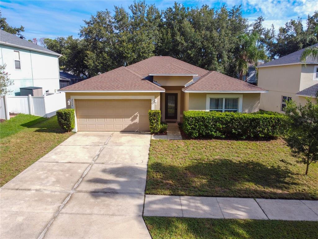 2339 Foxtree Road Tavares, FL 32778 - Photo 1 of 36 a front view of a house with garden