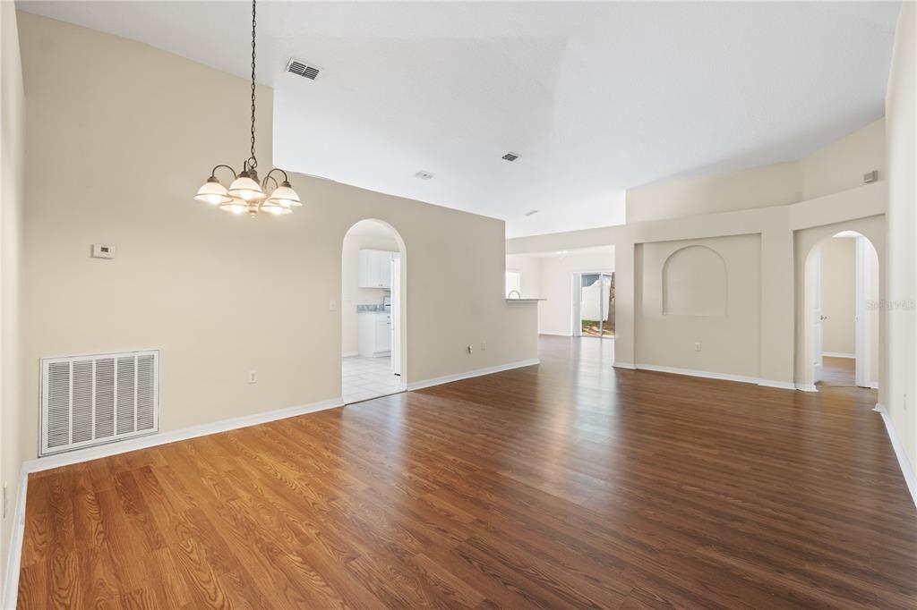 2339 Foxtree Road Tavares, FL 32778 - Photo 15 of 36 a view of a livingroom with wooden floor