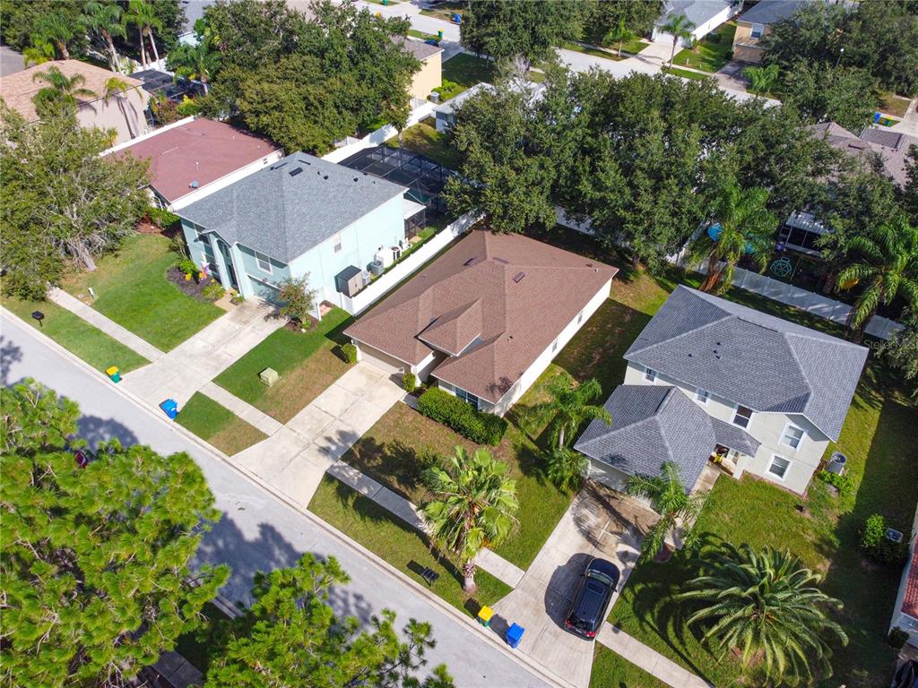 2339 Foxtree Road Tavares, FL 32778 - Photo 2 of 36 an aerial view of a house with a garden