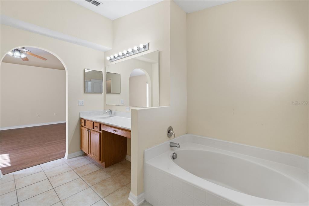 2339 Foxtree Road Tavares, FL 32778 - Photo 22 of 36 a spacious bathroom with a bathtub and a sink