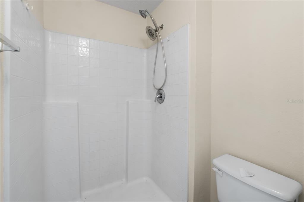 2339 Foxtree Road Tavares, FL 32778 - Photo 23 of 36 a bathroom with a shower and toilet