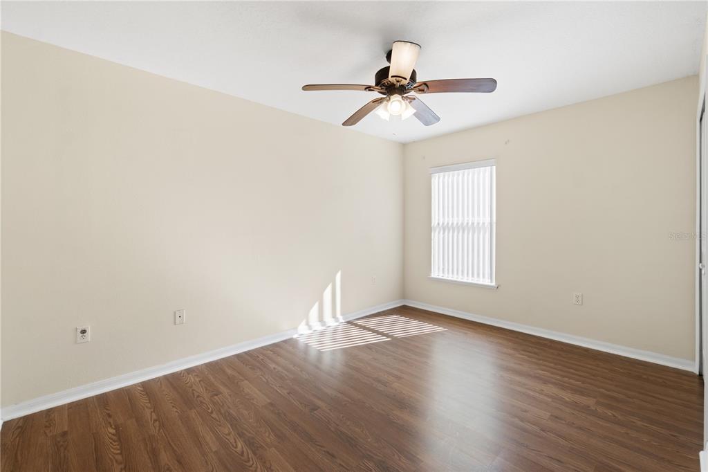 2339 Foxtree Road Tavares, FL 32778 - Photo 26 of 36 a view of a room with wooden floor closet and windows