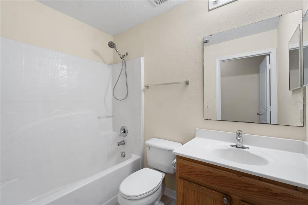 2339 Foxtree Road Tavares, FL 32778 - Photo 27 of 36 a bathroom with a sink a toilet and shower