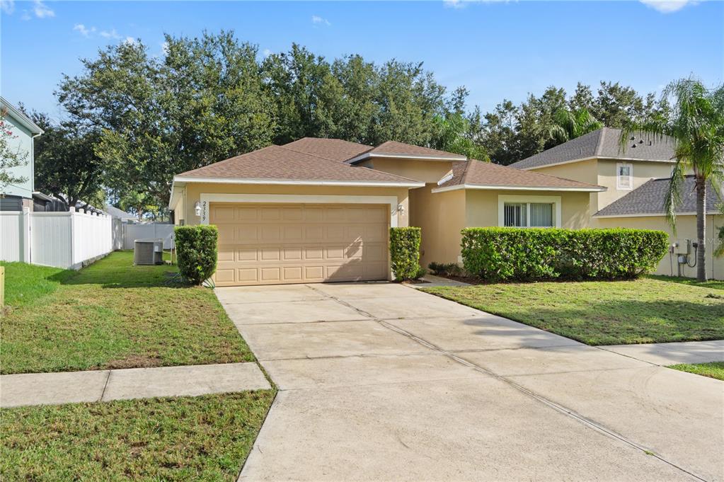 2339 Foxtree Road Tavares, FL 32778 - Photo 35 of 36 a front view of a house with a yard