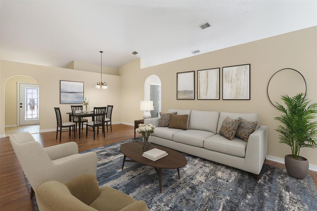 2339 Foxtree Road Tavares, FL 32778 - Photo 4 of 36 a living room with furniture potted plant and kitchen view
