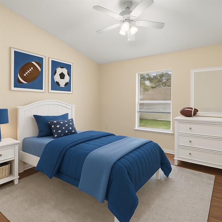 2339 Foxtree Road Tavares, FL 32778 - Photo 7 of 36 a bedroom with a bed and a window