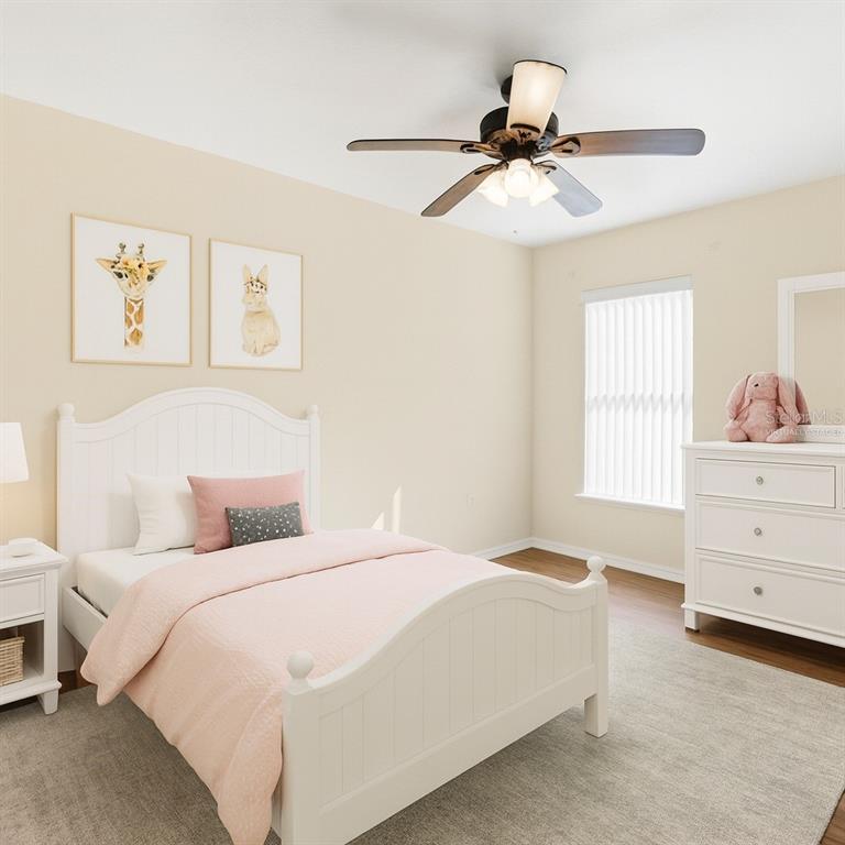 2339 Foxtree Road Tavares, FL 32778 - Photo 8 of 36 a bedroom with a bed and window