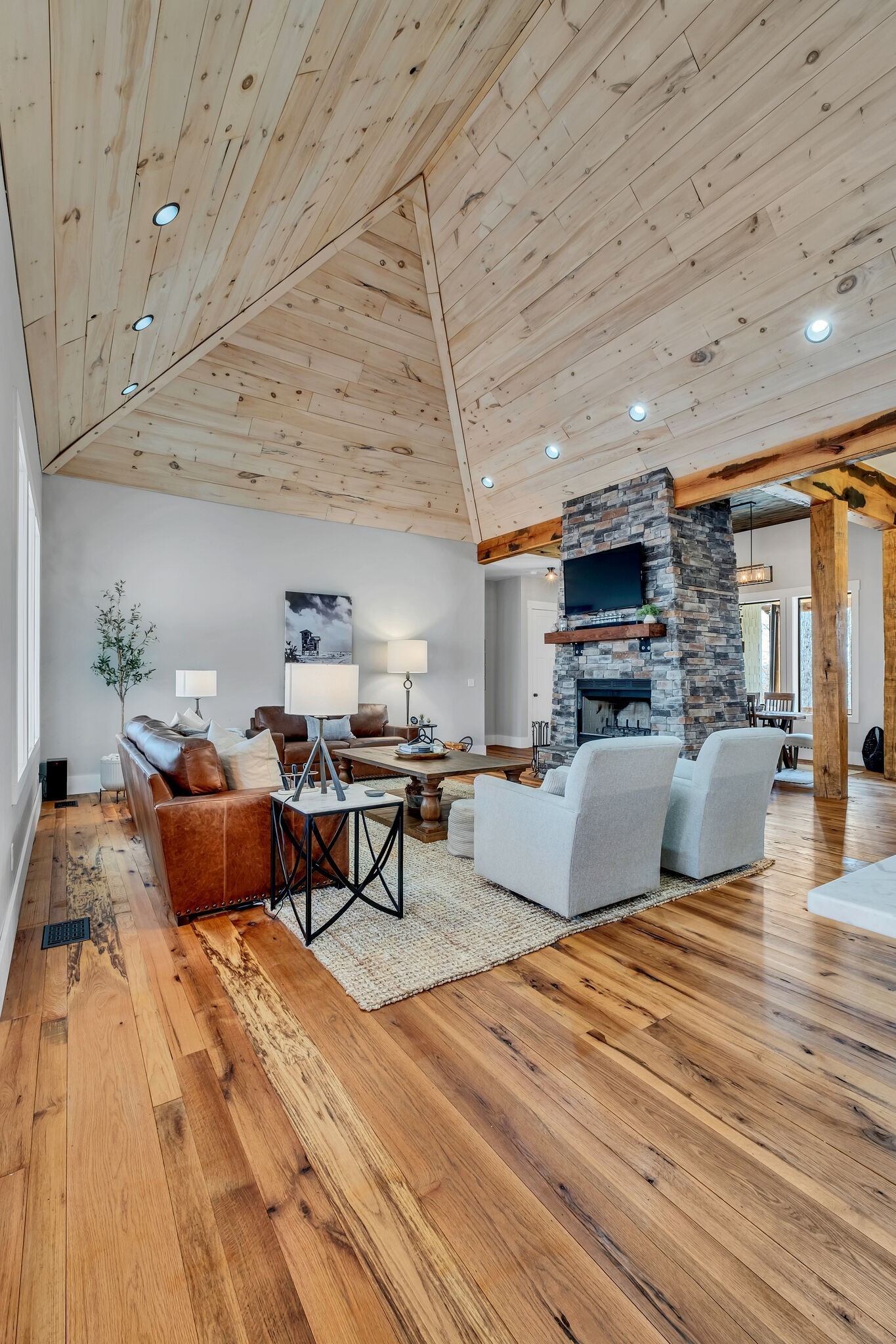 7890 Oscar Green Road Primm Springs, TN 38476 - Photo 14 of 52 a living room with furniture kitchen view and a wooden floor