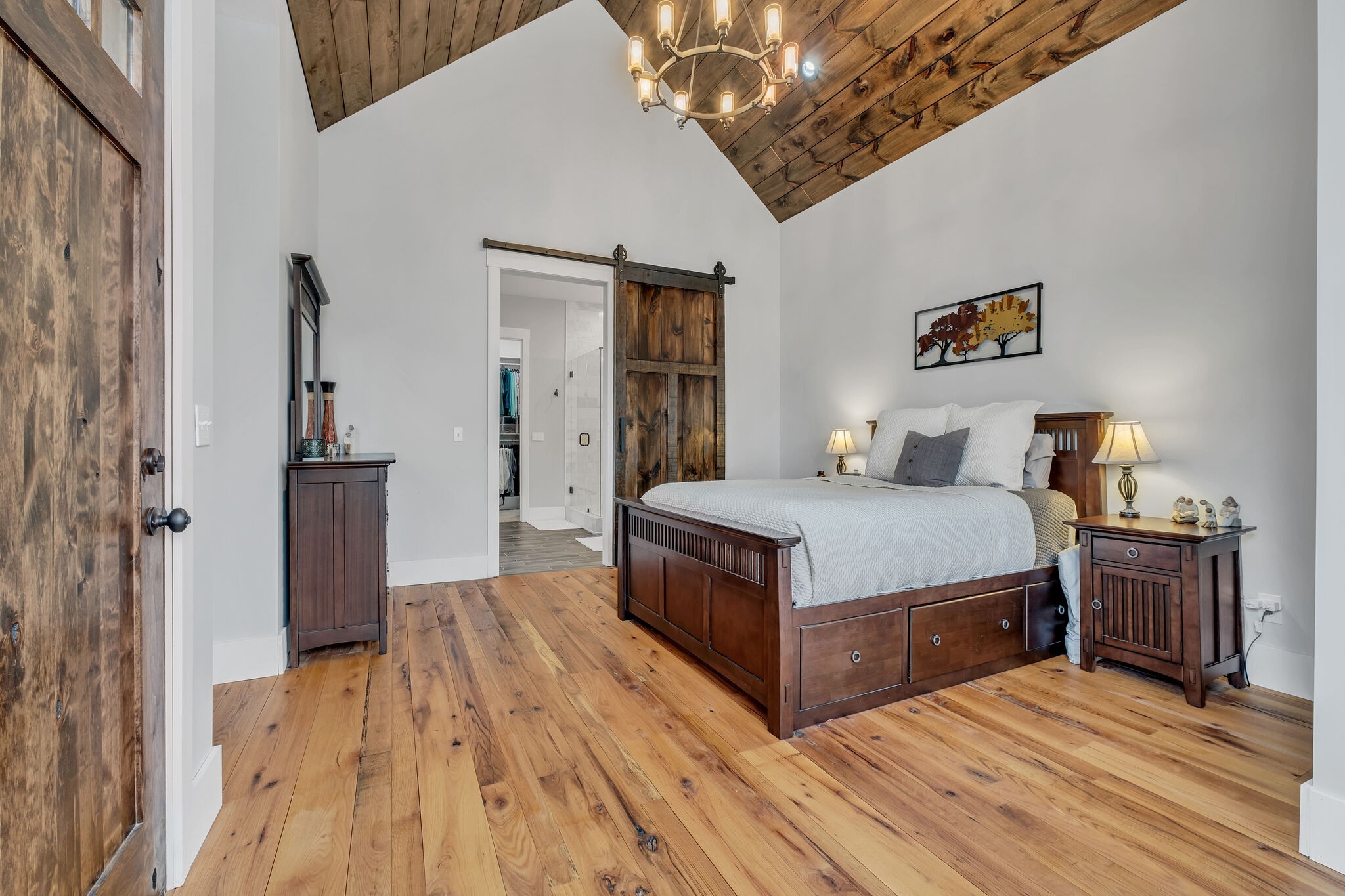 7890 Oscar Green Road Primm Springs, TN 38476 - Photo 21 of 52 a bedroom with a bed and wooden floor