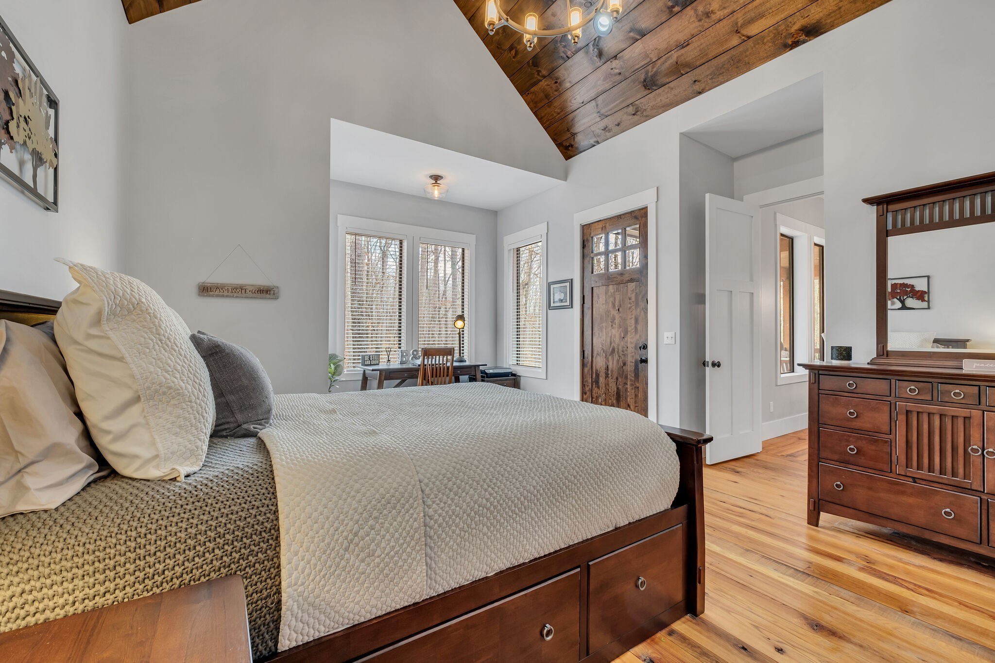 7890 Oscar Green Road Primm Springs, TN 38476 - Photo 22 of 52 a spacious bedroom with a bed a mirror and desk